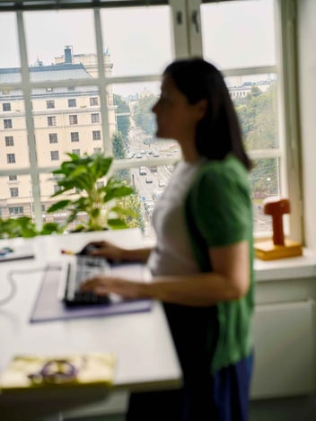 Person working at a standing desk