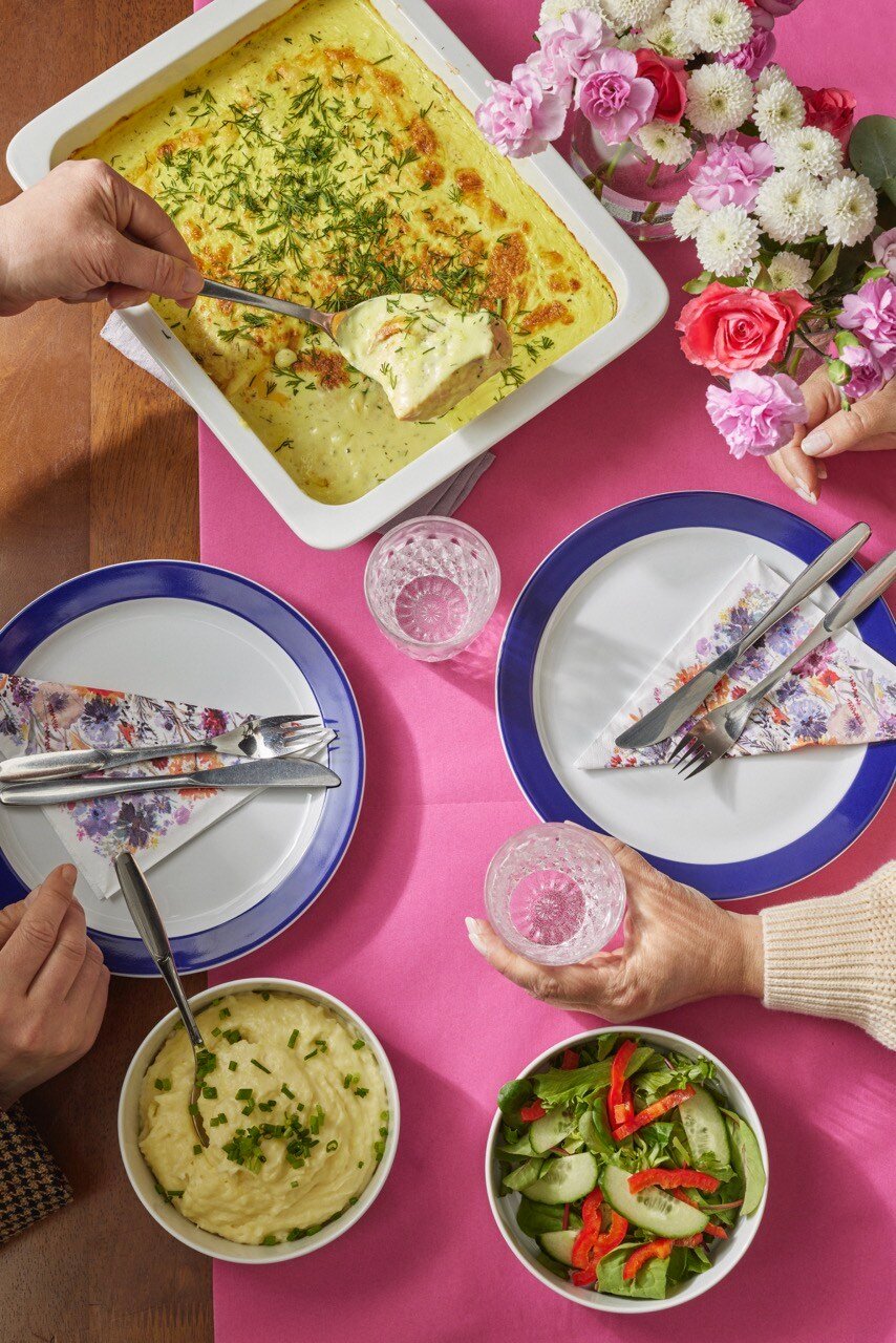 Colorful dinner table with a fish dish